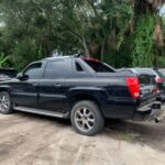 Cadillac Escalade EXT 2001-2006 in a junkyard in the USA