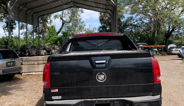 Cadillac Escalade EXT 2001-2006 in a junkyard in the USA